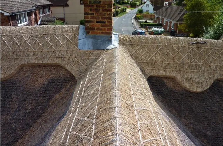 Patterned ridge with chimney leadwork