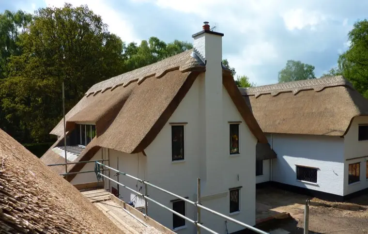 White-rendered house with chimney gable