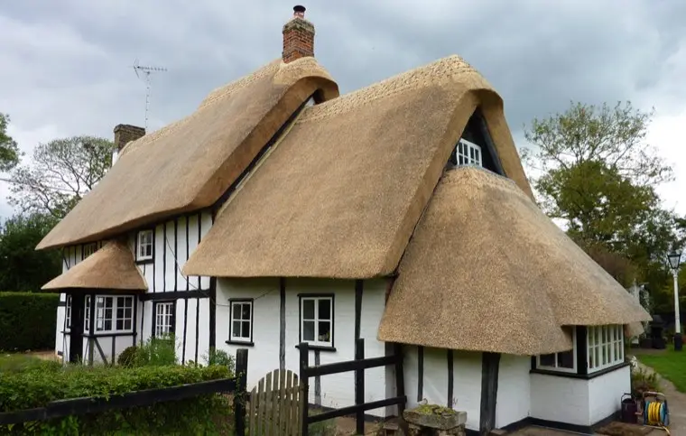 Long straw thatched cottage