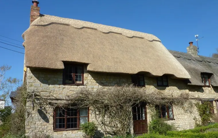 Stone cottage with eyebrow dormers