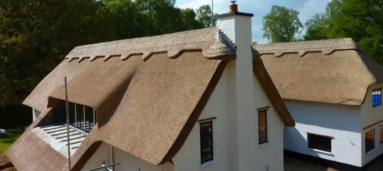 White-rendered house with chimney gable