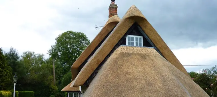 Steep thatched gable with window