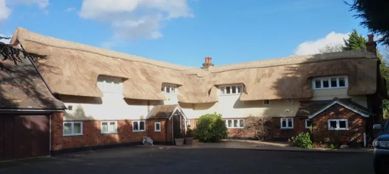 Long brick and render house